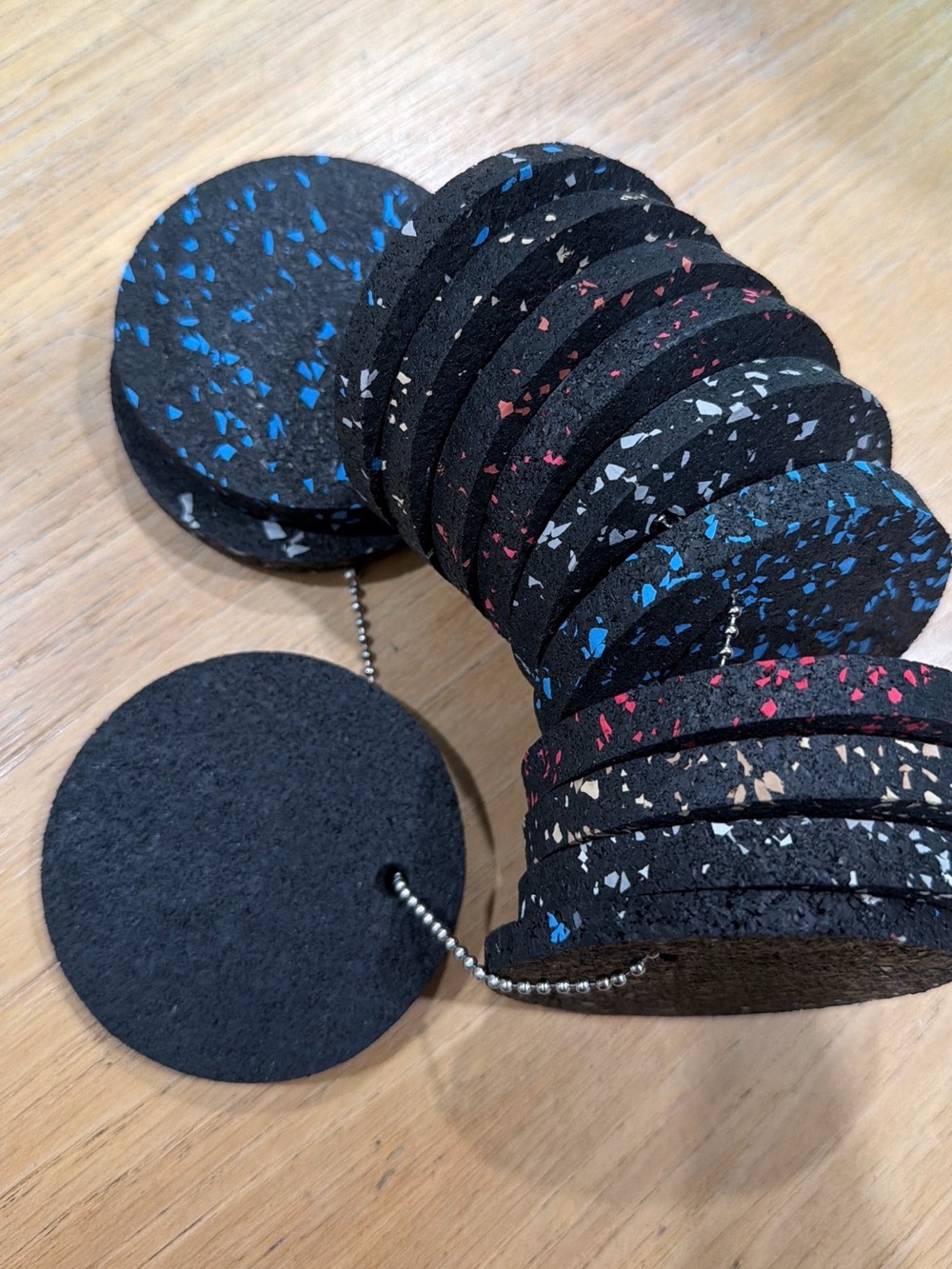 String of 3” wide rubber pads, colorful sets of 12-> good for coasters…
